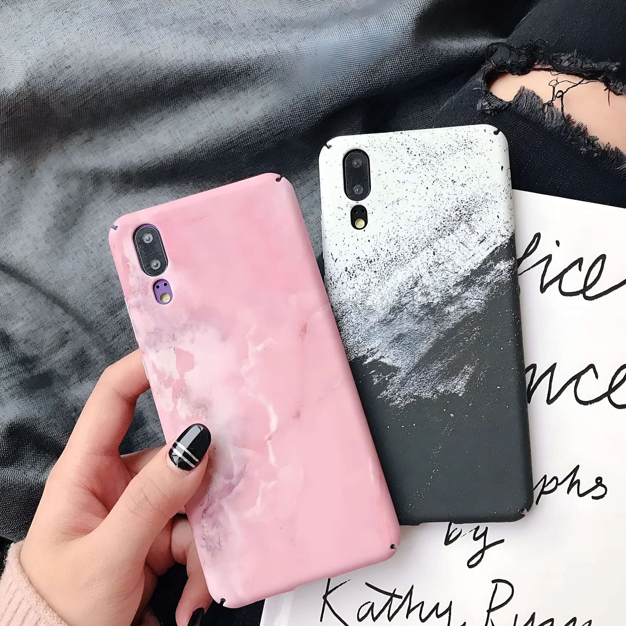 Black painted hard back phone case for Huawei models on a white background.