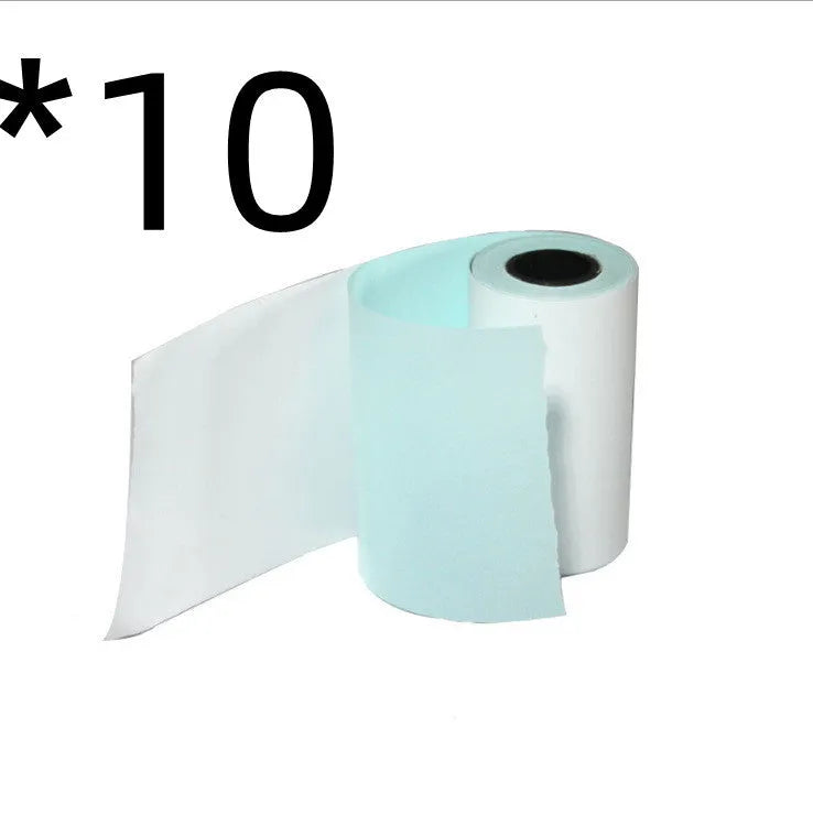 Bluetooth mini thermal photo printer in pink with USB cable and paper rolls on a white background