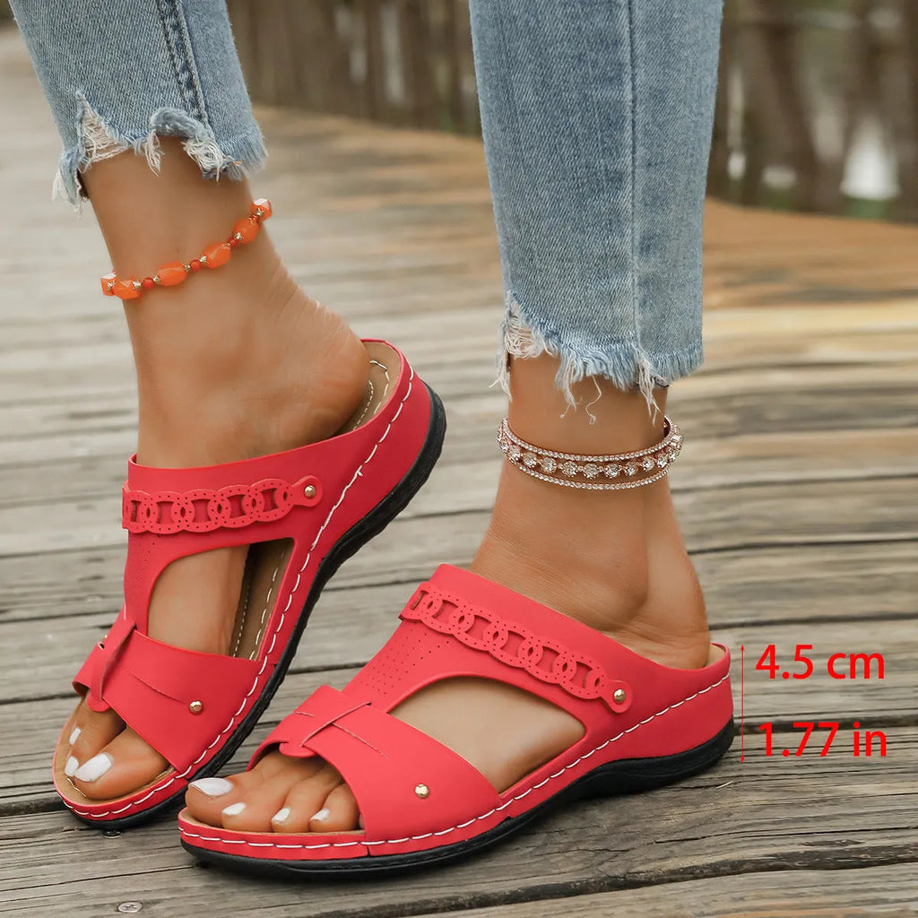 Roman style slope heel slipper in blue with a fish mouth toe holder and rubber sole