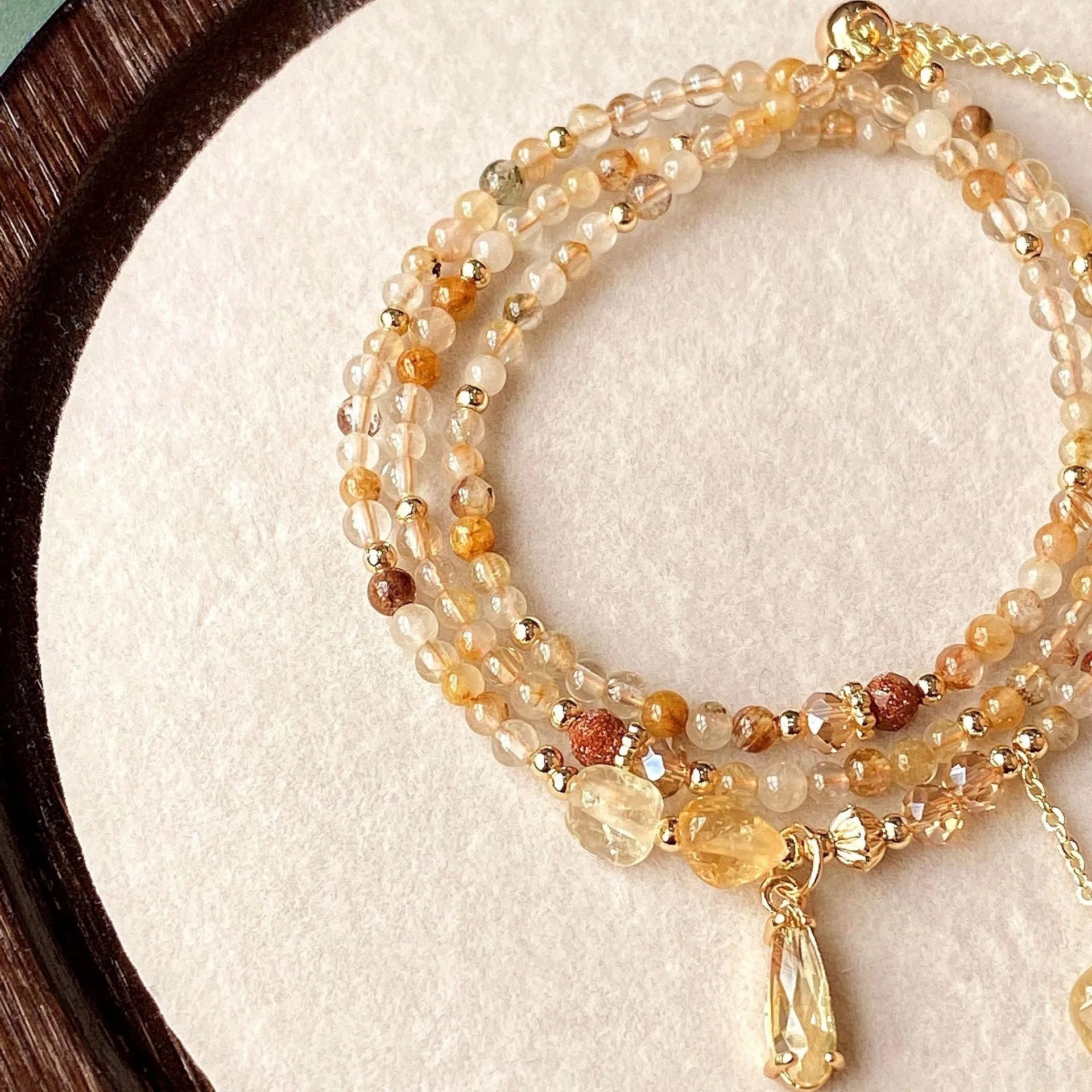Women's multi-layer bracelet with caramel citrine stones and gold electroplated three-circle design