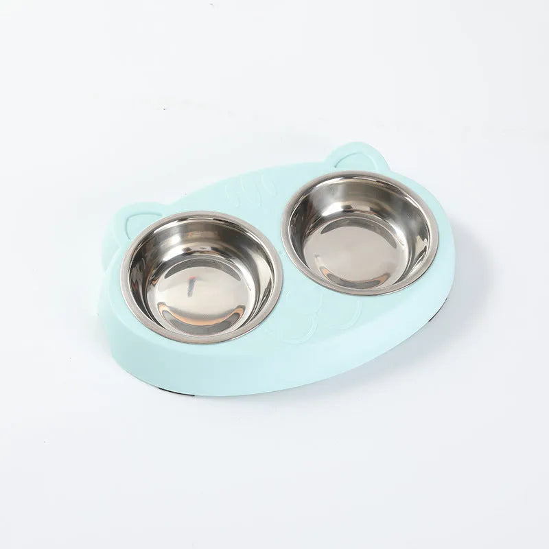 Blue plastic macaron-shaped double bowl pet feeder tray with a non-slip base and centre divider.