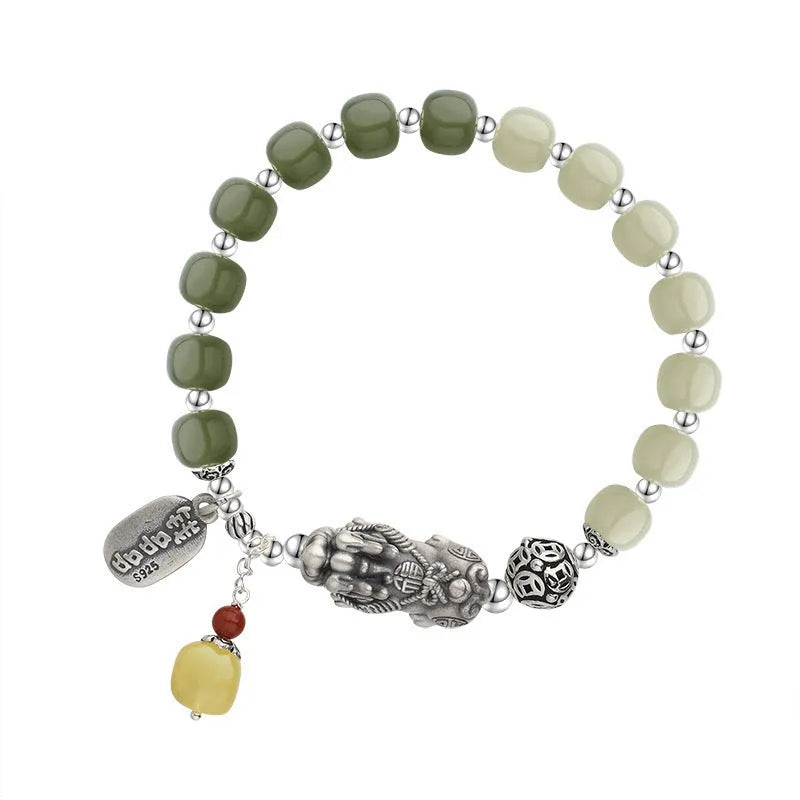Retro-style pure silver bracelet for women with natural Hetian jade bead pendants.