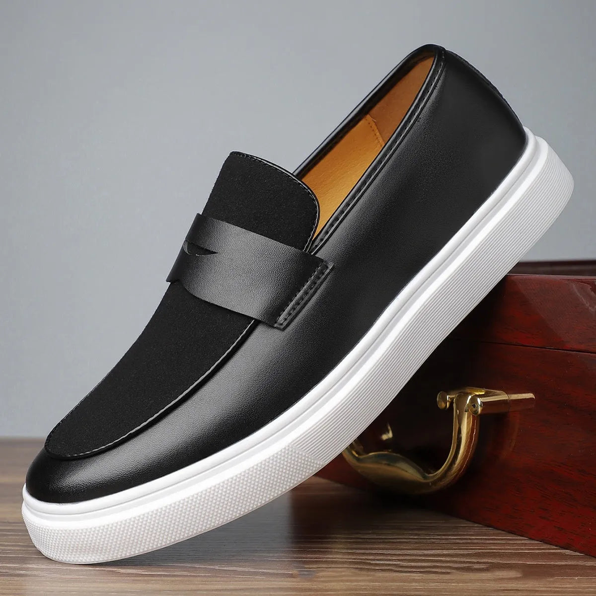 Black men's slip-on casual shoes with tassel detail, round toe and rubber sole