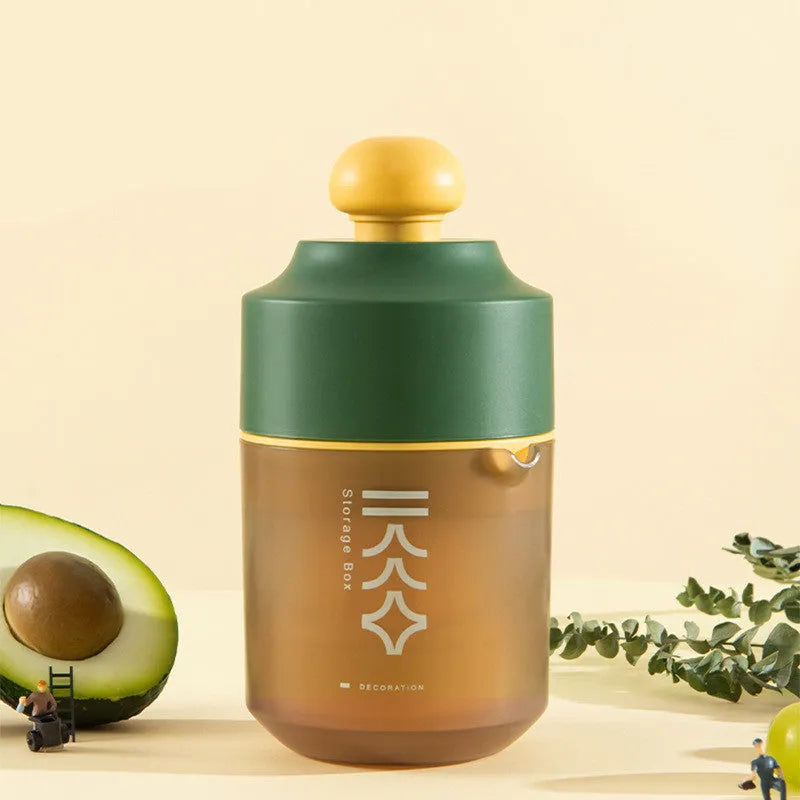 Green manual handheld citrus juicer with 400ml capacity on a kitchen counter