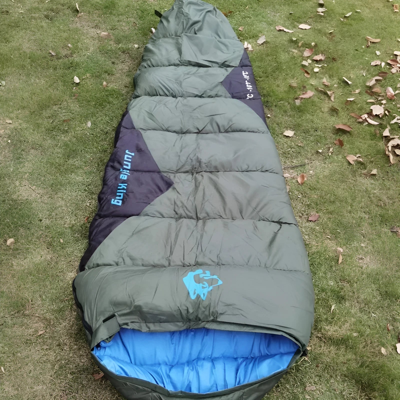 Cotton camping sleeping bag in Army Green with its compression storage bag.