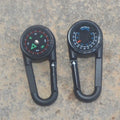 Black zinc alloy carabiner with built-in circular compass and rectangular thermometer display.