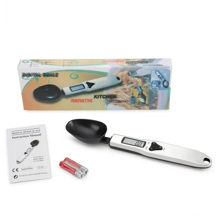 Stainless steel smart digital measuring spoon with a black LCD display showing weight measurement.