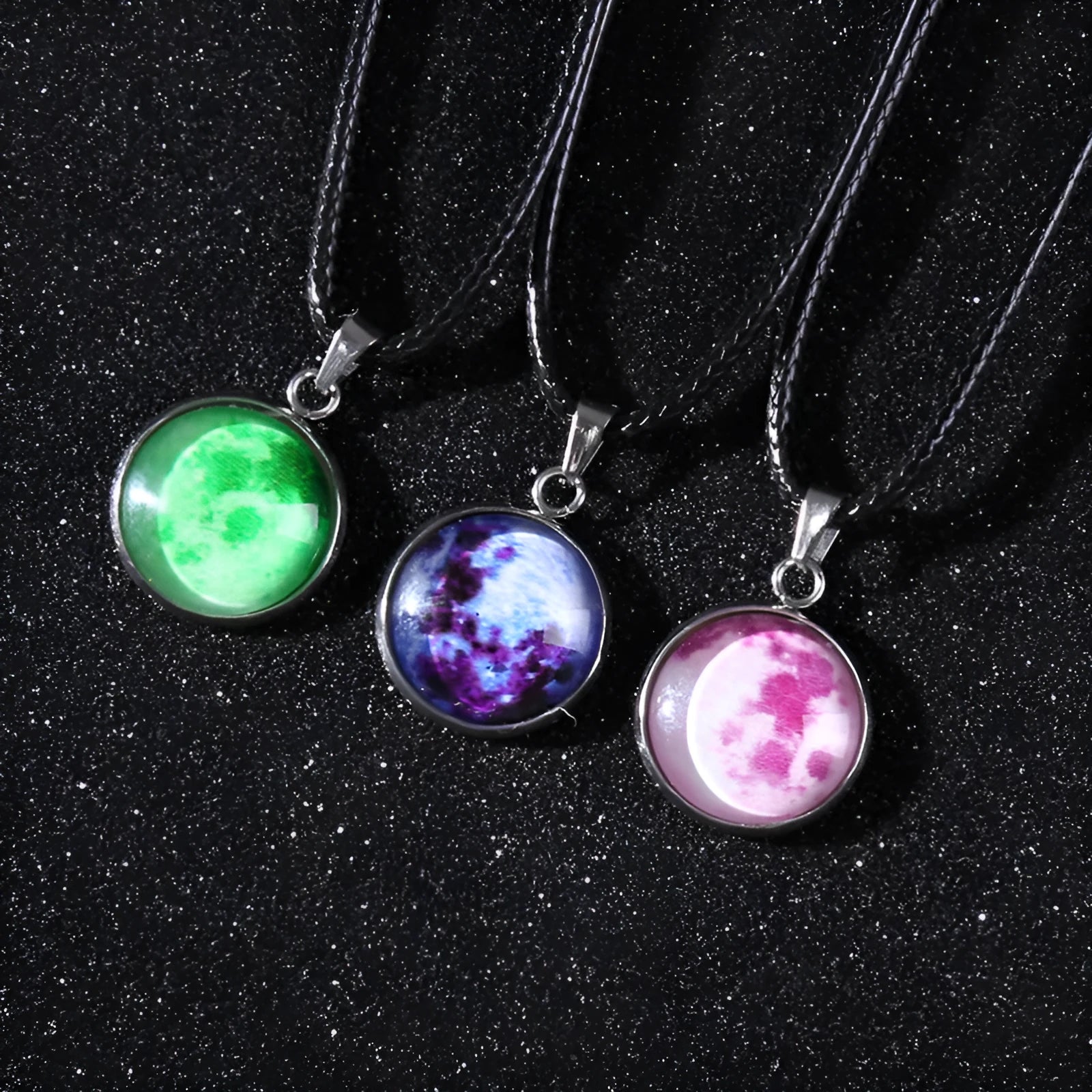 Close-up of a constellation design glass pendant on an alloy chain necklace with extension.