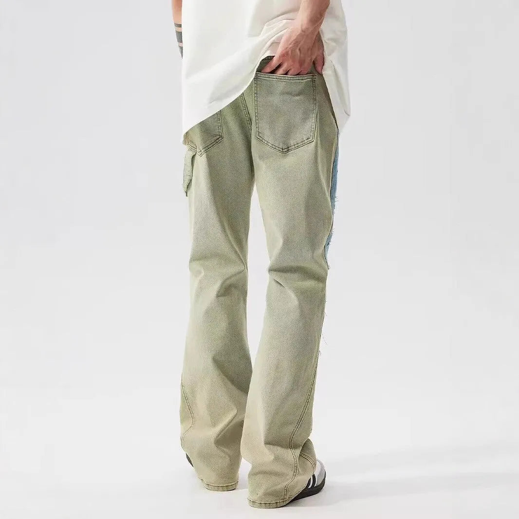 Retro yellow and blue patchwork splash-ink damaged design denim jeans on a mid-waist fit.