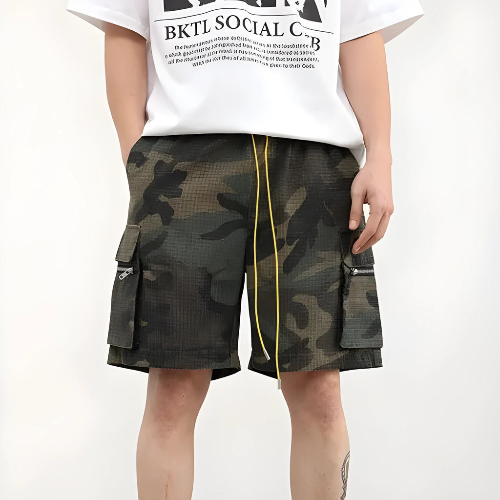 Men's camouflage cargo shorts with multiple pockets showing cropped length and mid-waist design