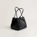 Cute small square bucket bag for women in textured PU, available in six solid colours including green and black.