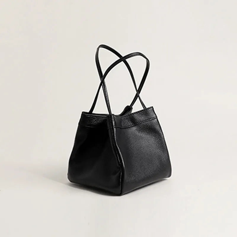 Cute small square bucket bag for women in textured PU, available in six solid colours including green and black.