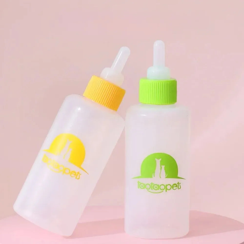 Set of four coloured pet milk bottle feeders with silicone teats and a cleaning brush for small animals.