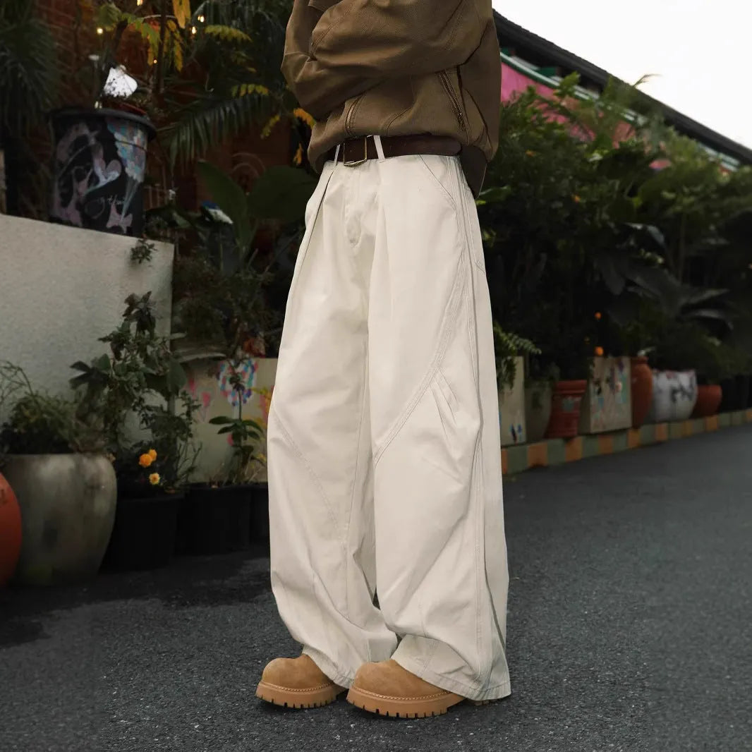 Men's straight-leg pleated trousers in black, brown, and apricot colours with mid-waist design