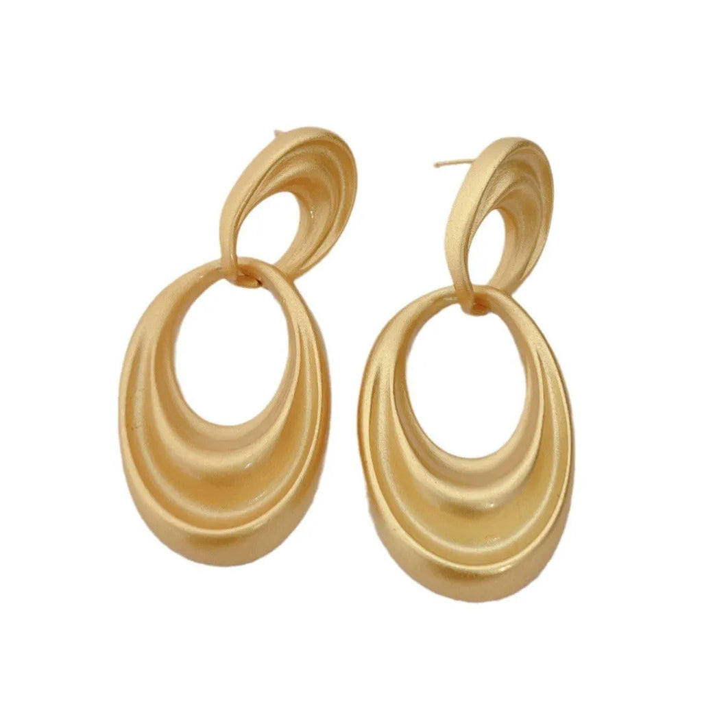 French retro style copper earrings with a U-shaped double circle design in a gold and quicksand finish.