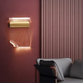 Simple wall lamp with a bendable arm and acrylic shade mounted on a wall.