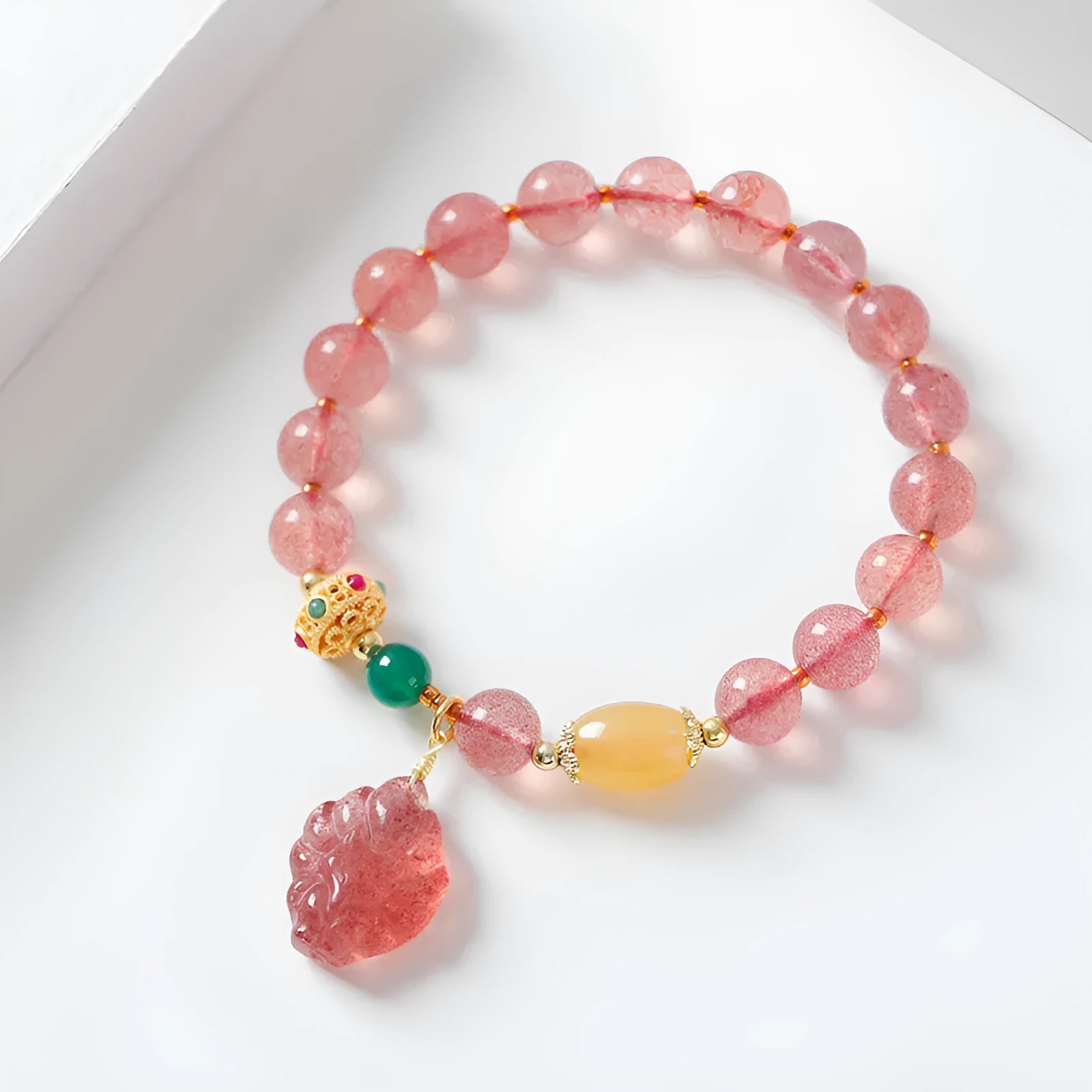 Women's crystal bracelet with strawberry quartz beads in nine tail fox design