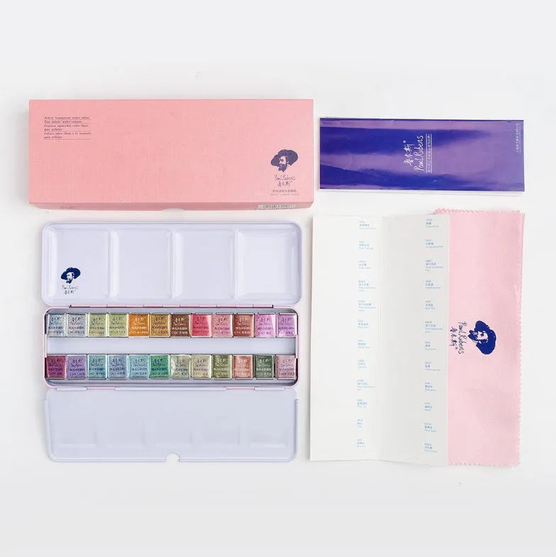 Pearl-effect solid watercolour paint pans in a set showing iridescent colours.