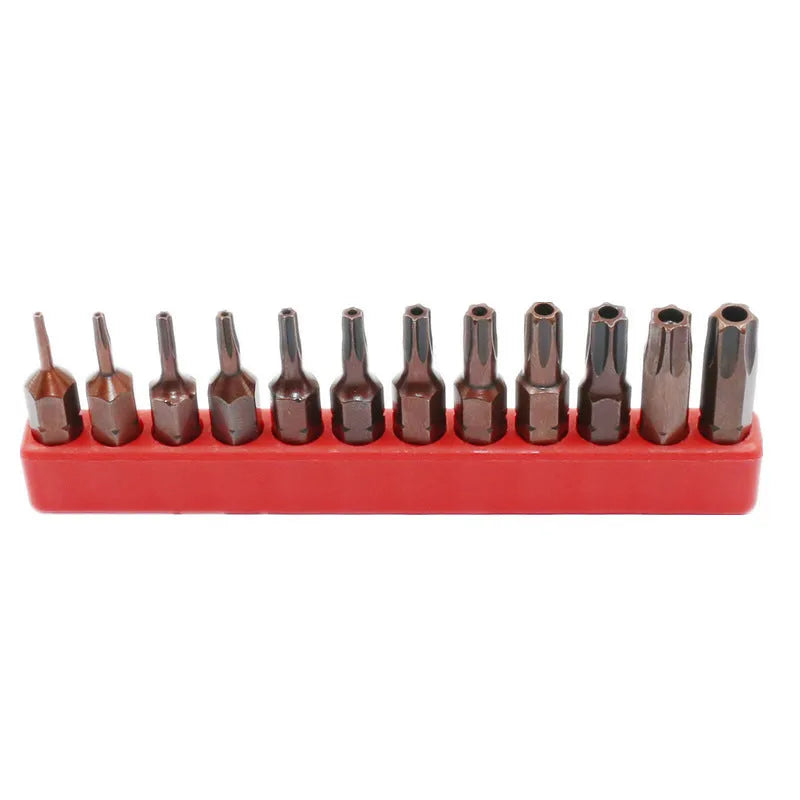 Black steel screwdriver bits T6 to T40 with hollow and solid hex heads on a magnetic strip.