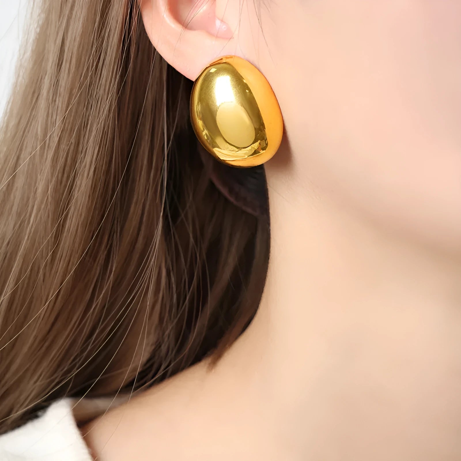 Geometric stainless steel ear studs with exaggerated glazed surface finish in DFE139 colour