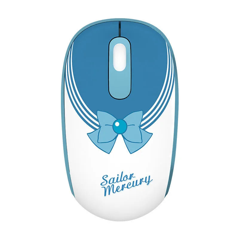 Pink Sailor Moon cartoon wireless mouse with USB receiver on a desk.