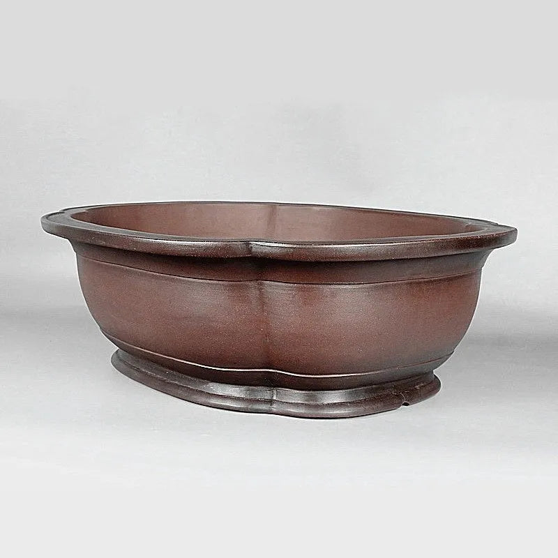 Handmade Chinese crabapple-shaped purple clay flowerpot for plants.