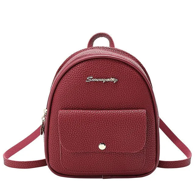 Black PU leather small women's backpack with zipper, shown as a shoulder bag.