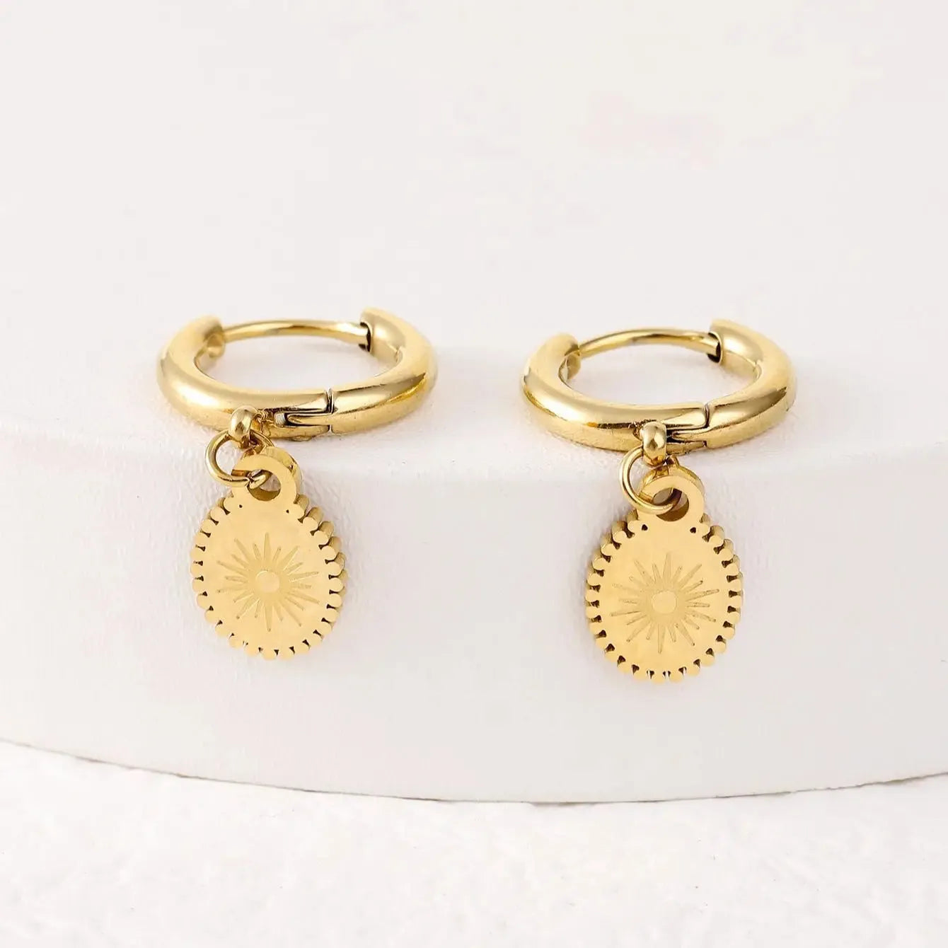 Stainless steel geometric ear button earrings with ellipse design in silver tone