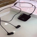 Black Bluetooth audio receiver headphones with lavalier clip for running and hands-free calling