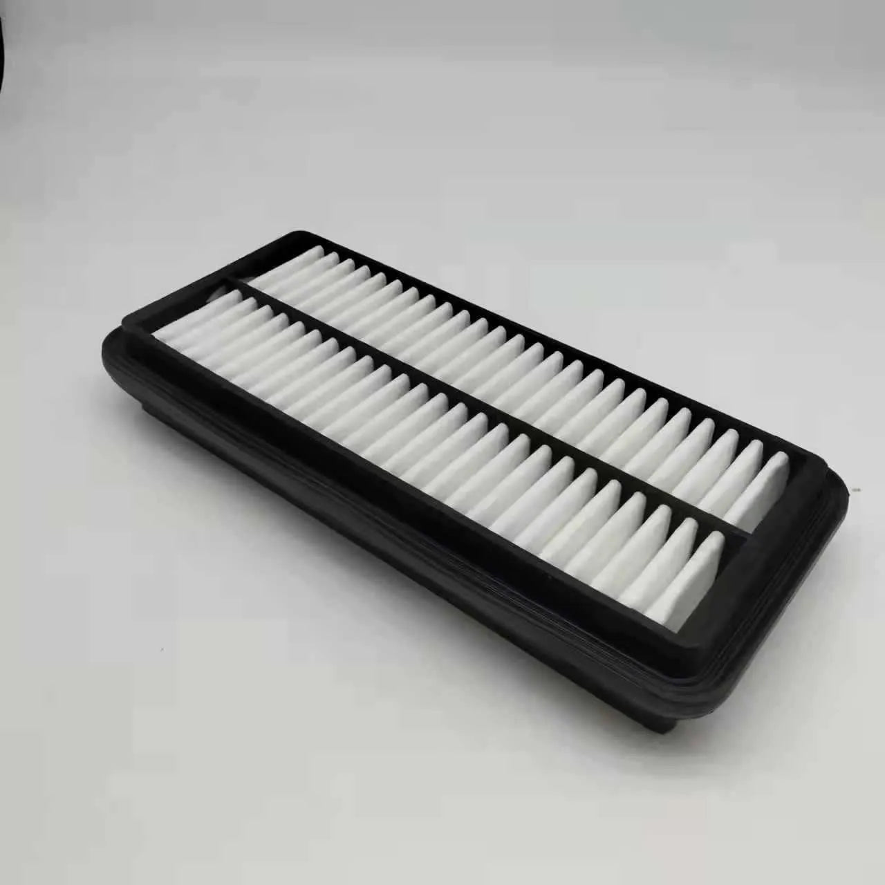 Black panel car air filter with dimensions 256mm by 113mm by 40mm for Modern vehicles.
