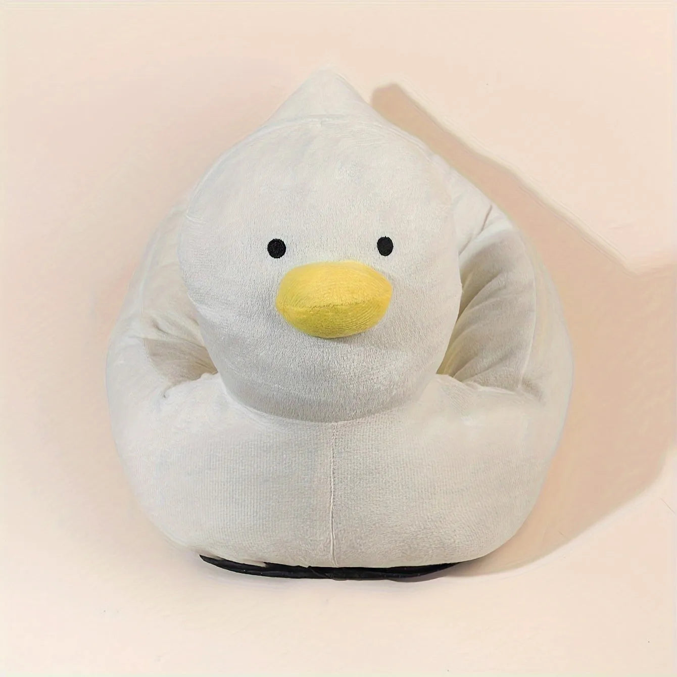 Blue duck-shaped fluffy pet bed sofa for a small dog, showing raised sides and soft material.