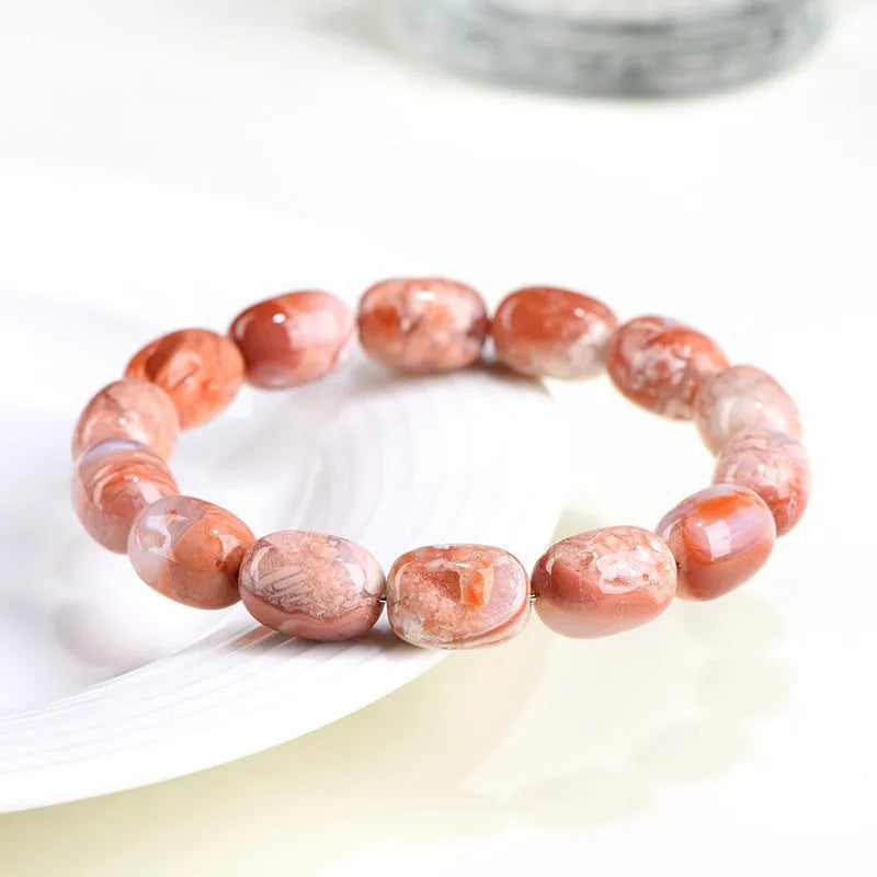 Natural cherry agate barrel bead bracelet with 10x14mm ruyi motifs geometric design
