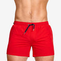 Men's mesh-lined swimming shorts in solid colours for sports and fitness activities
