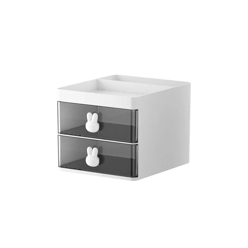 Transparent partitioned desktop storage box in cherry blossom pink with grid compartments and dustproof lid