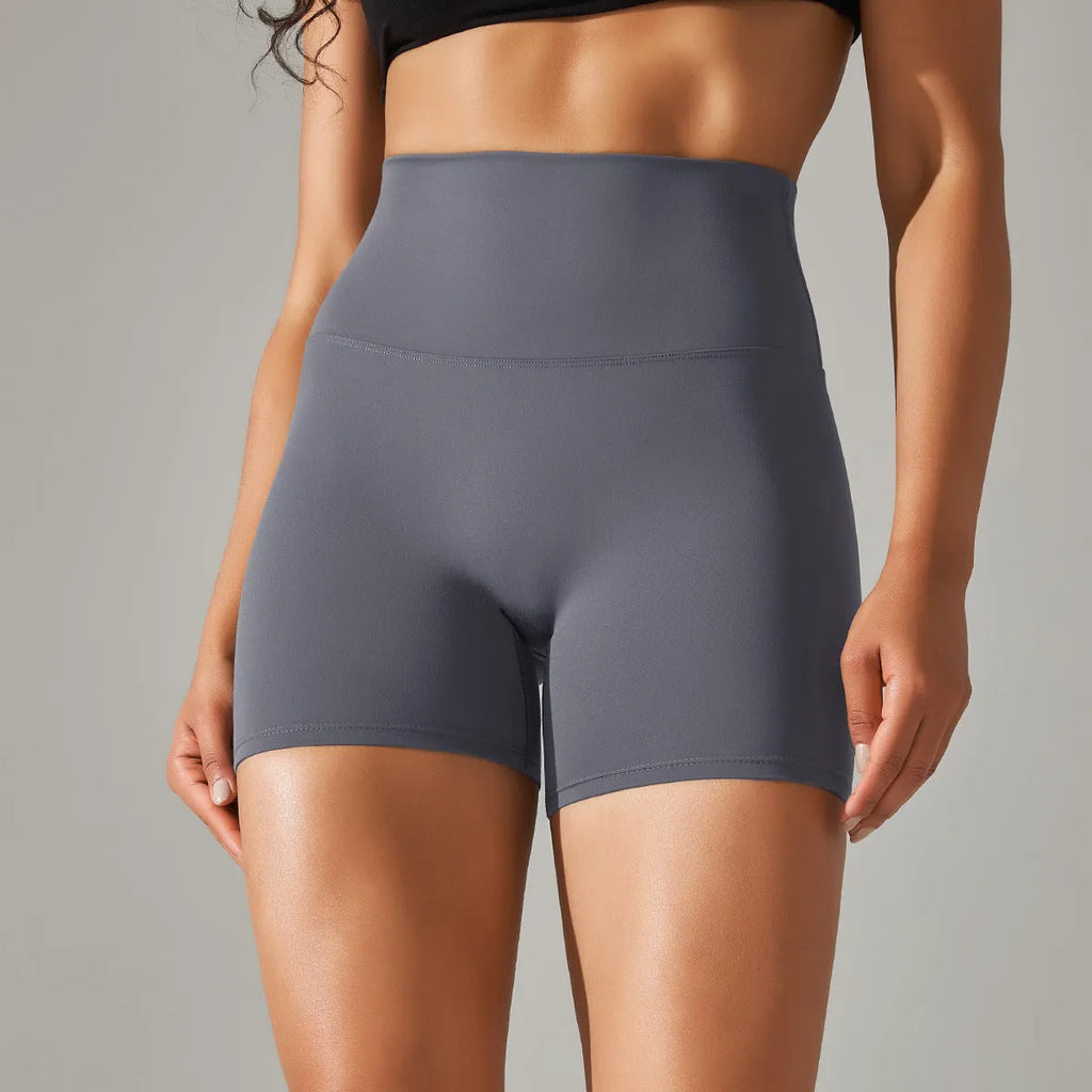 Women's high waist fitness tights in dark green colour with hip lift design for workout and daily wear