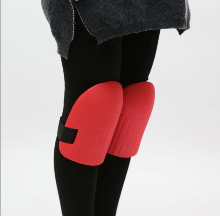 Pair of rectangular EVA foam knee pads in chosen colour on a garden surface