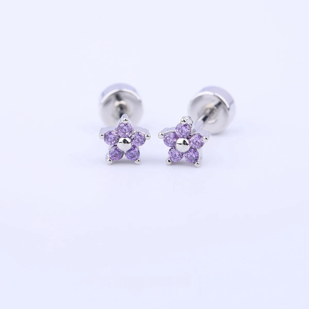 Titanium steel copper-plated gold micro inlaid zirconium five-petal plum flower ear studs in blue colour