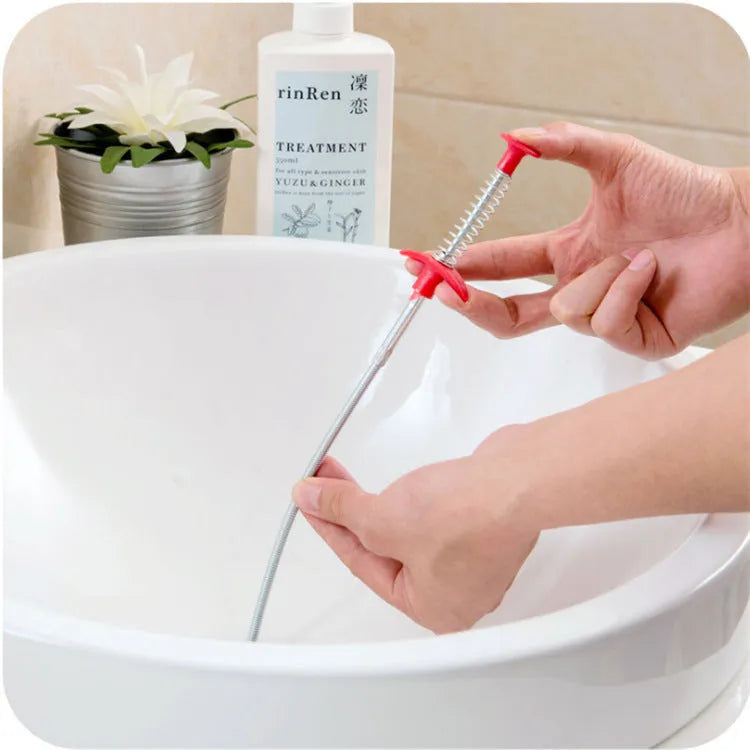 Black sewer dredger spring drain cleaning tool with handle and coiled end for pipe unclogging.
