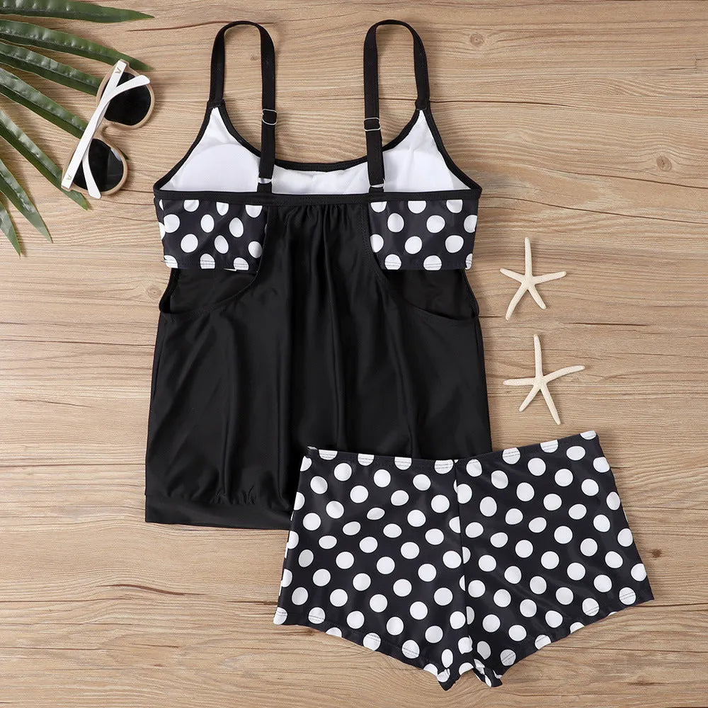 Women's black polka dot high-waist boxer swimsuit set on a mannequin