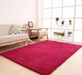 Solid colour fluffy area rug with non-slip dotted backing in a neutral living room setting