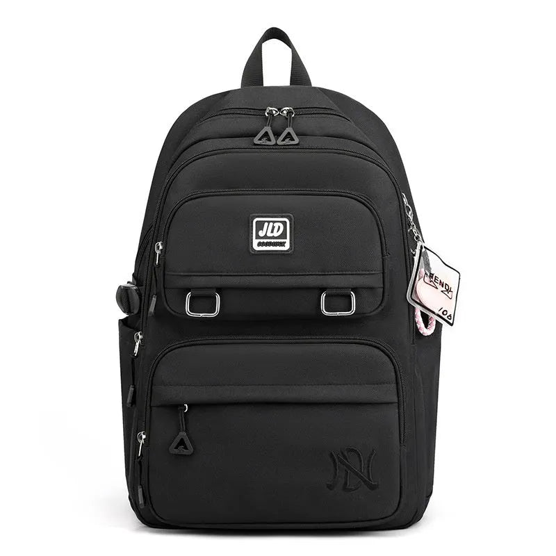 Girls' large capacity nylon school backpack in purple, shown with breathable back and anti-theft features.