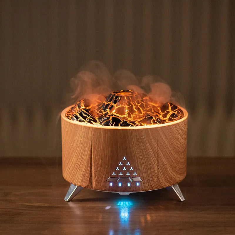 White mini simulated flame ultrasonic aromatherapy humidifier on wooden surface with remote control