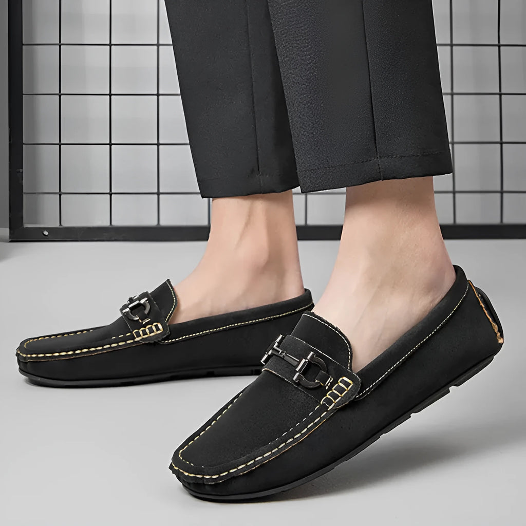 Men's brown leather slip-on loafers with a round toe and rubber sole.