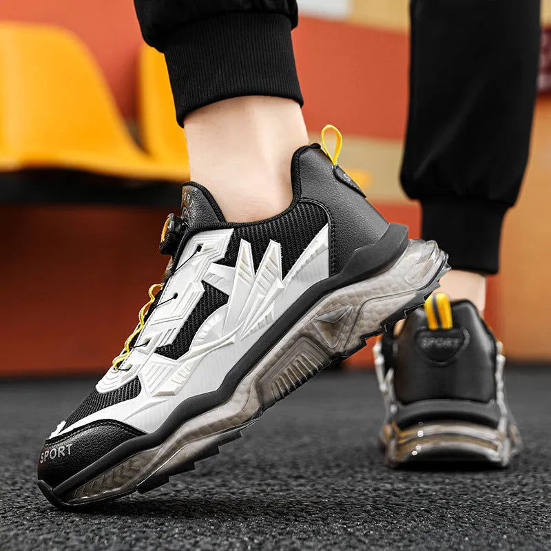 Men's black mesh casual shoe with rotating button fastener and platform sole.