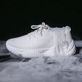 Women's white thick-soled sports shoes with a woven upper and front strap in a candy colour.