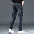Men's slim straight casual trousers in thin polyester fabric shown in black and blue-grey colour options
