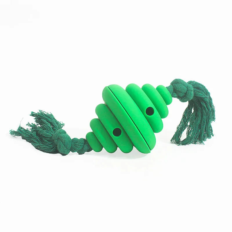 Green and yellow dog ball with rope attachment, showing treat-dispensing hole.