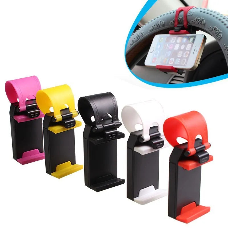 Black universal steering wheel phone holder clip mount attached to a car steering wheel.