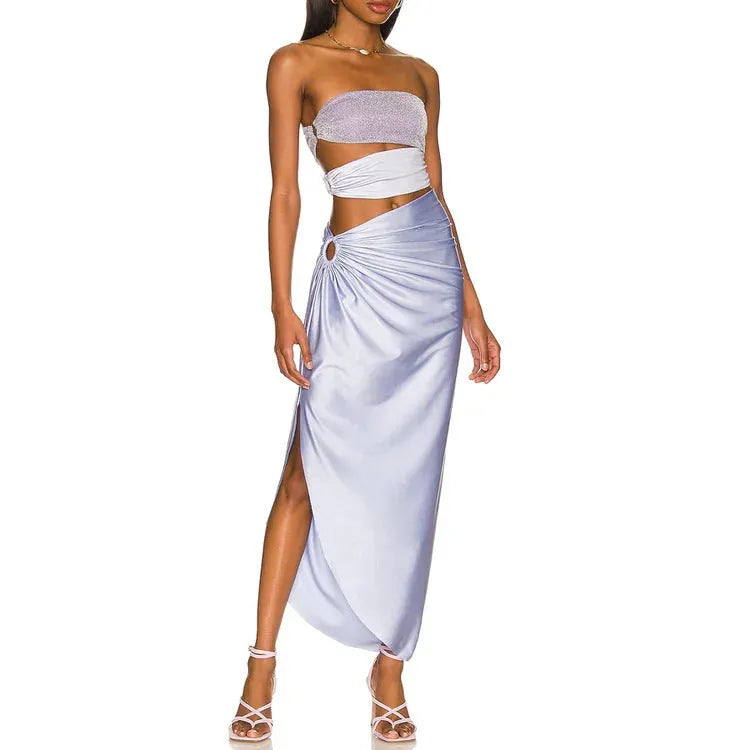 Purple one-piece swimsuit and matching wrap skirt set on a hanger.