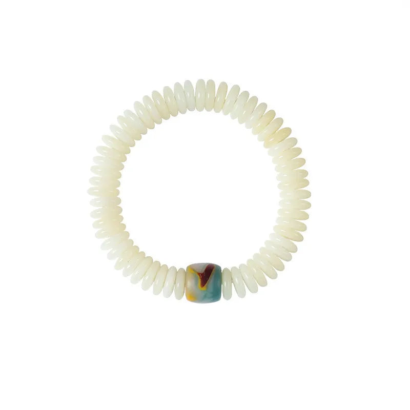 White Bodhi seed Tibetan bracelet showing 3x10mm dimensions in bracelet and handheld styles